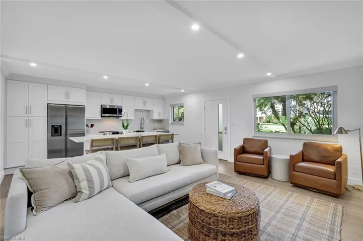 Living room featuring light wood-type flooring and recessed lighting