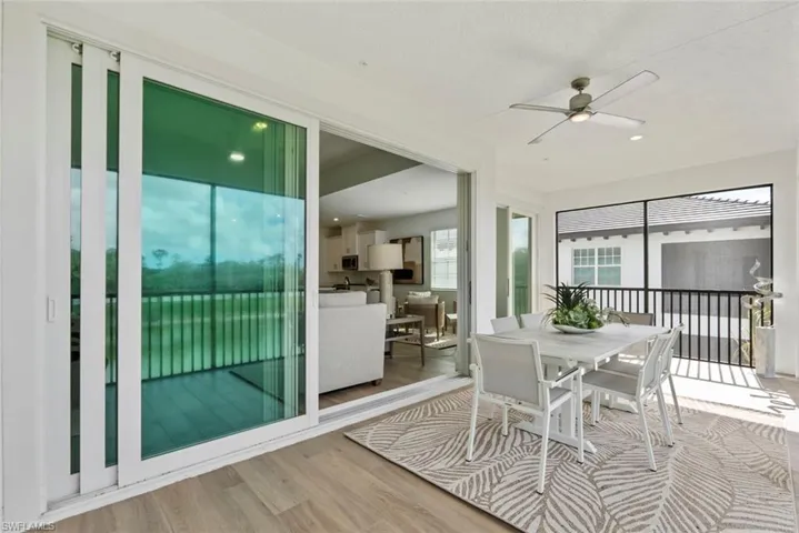 Sunroom / solarium with ceiling fan and a healthy amount of sunlight
