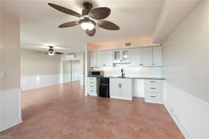 Plenty of space for a dining table & a convenient wet bar