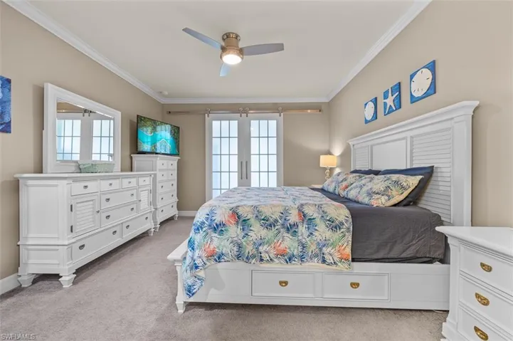 Primary Suite with custom barn doors dividing from Bonus Room