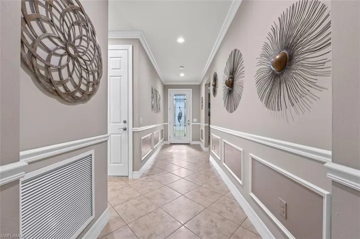 Foyer with custom molding and chair rail.