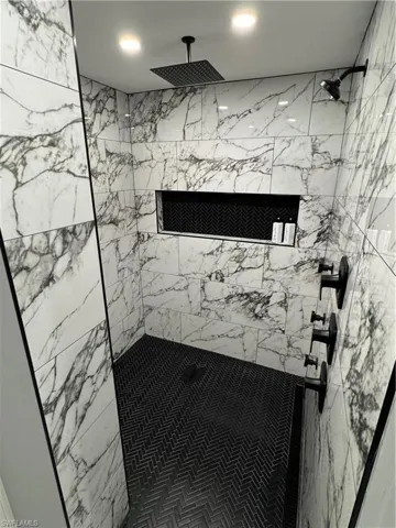 Full bath with a shower stall