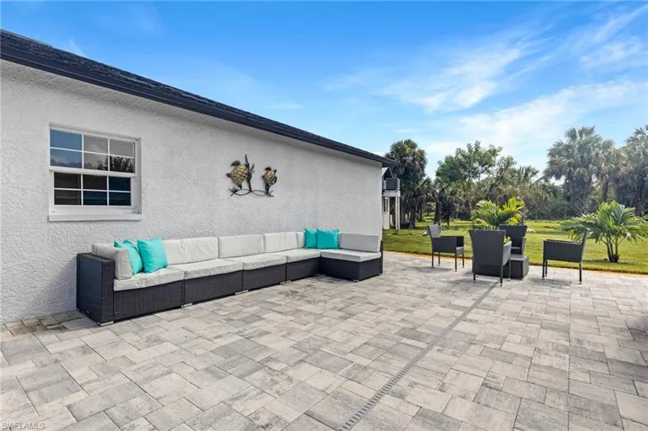 View of patio featuring an outdoor hangout area