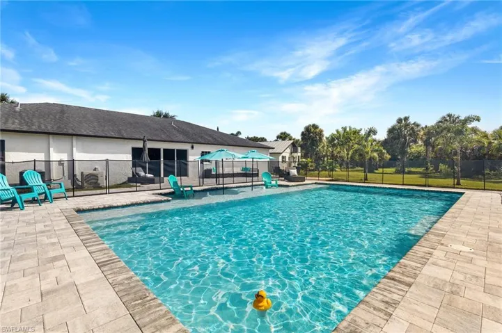 View of pool featuring a fenced in pool, fence, and a patio