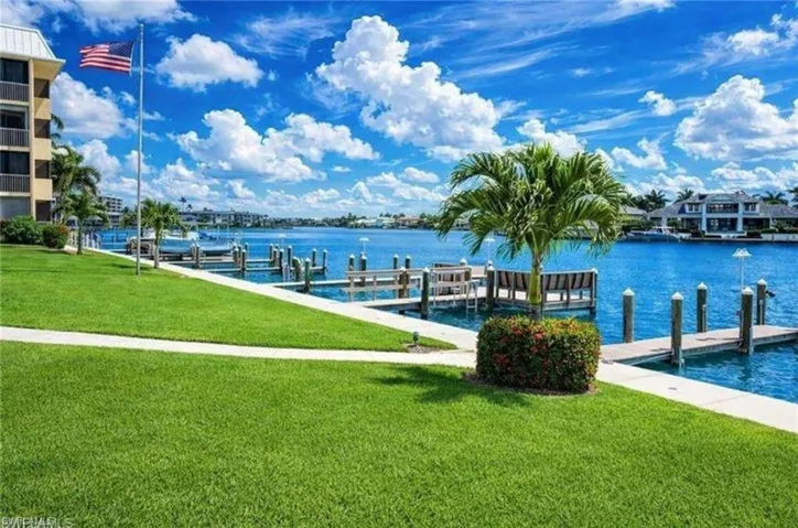 Dock with a yard and a water view