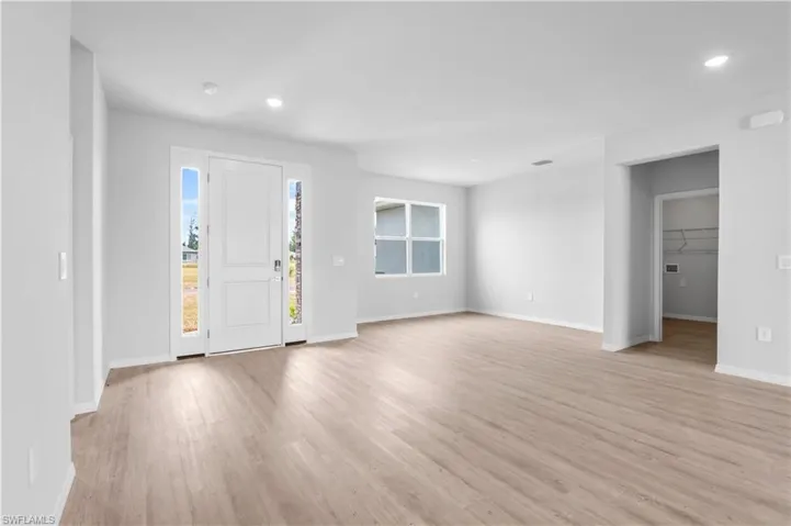 Entrance foyer featuring light wood finished floors and recessed lighting