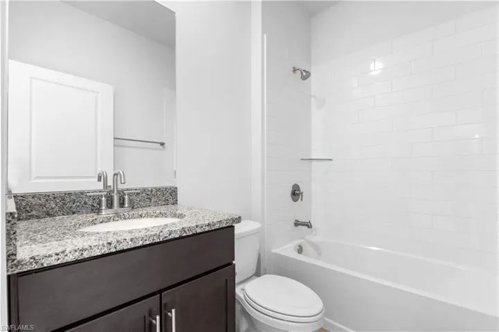 Full bathroom featuring vanity and shower / bath combination