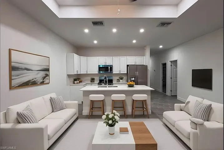 Living room featuring light wood-style floors and recessed lighting
