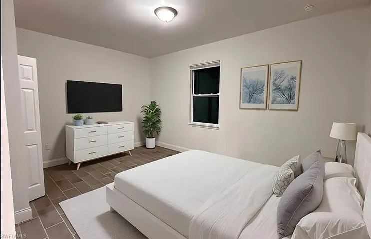 Bedroom with baseboards