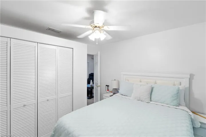 Bedroom featuring a closet and a ceiling fan
