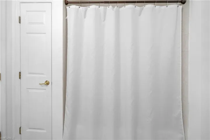 Bathroom featuring a shower with shower curtain