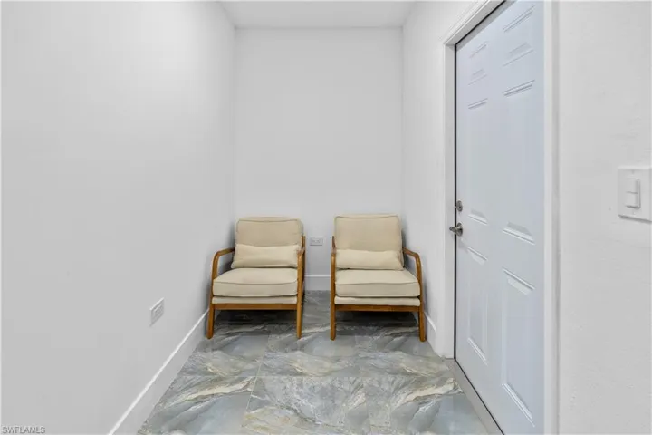 Living area featuring baseboards