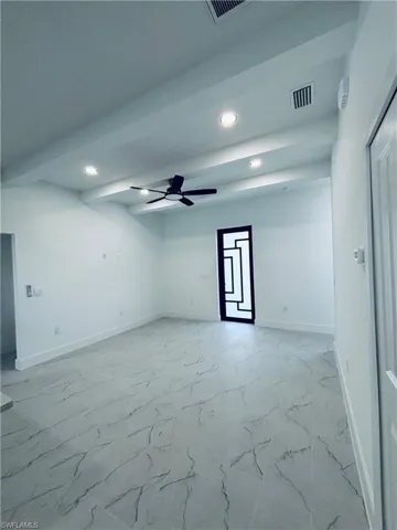 Empty room featuring recessed lighting and ceiling fan