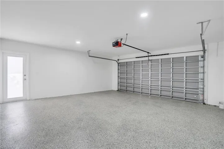 Two car garage with the Hurricane garage door and Epoxy garage floor.