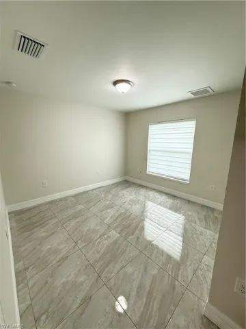 Empty room with baseboards