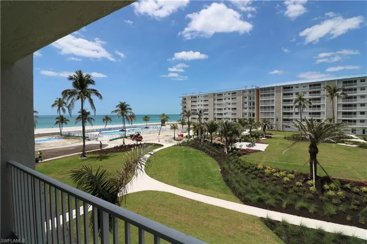 Surrounding community with a beach view and a water view