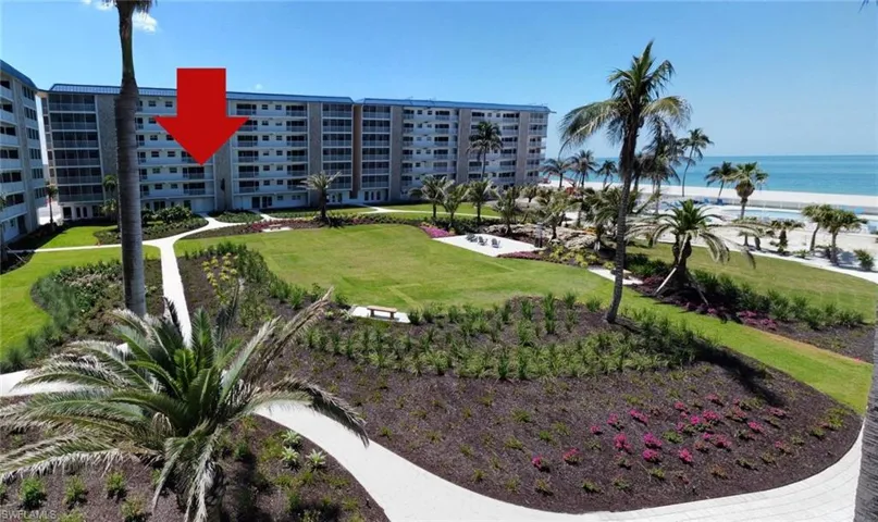 View of home's community featuring a water view and a yard