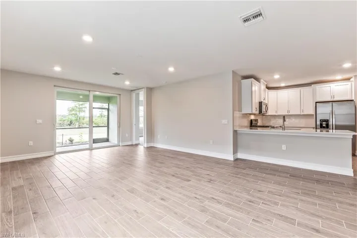 Unfurnished living room with recessed lighting and light wood finished floors