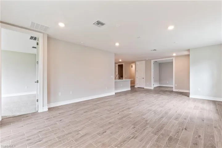 Unfurnished room with recessed lighting and light wood-type flooring