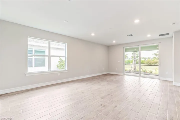 Unfurnished room with recessed lighting and light wood-style floors