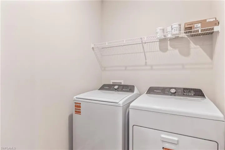 Washroom featuring separate washer and dryer
