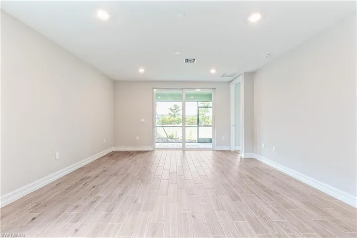 Empty room featuring recessed lighting and light wood-style floors
