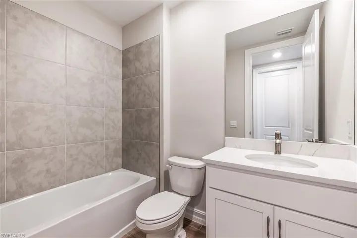 Full bathroom featuring vanity and tub / shower combination