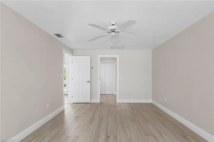 Bedroom featuring light wood-style flooring and a ceiling fan