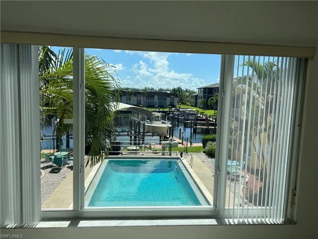 View of pool featuring a water view