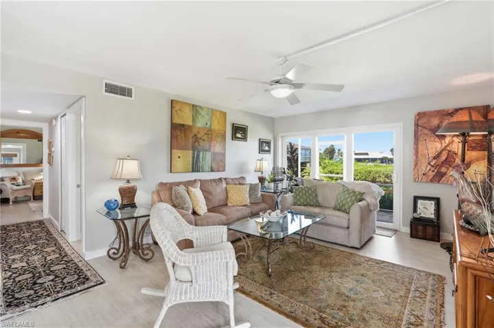 IMPACT RESISTANT SLIDING DOORS TO SCREENED LANAI OVERLOOKING TARPON BAY..