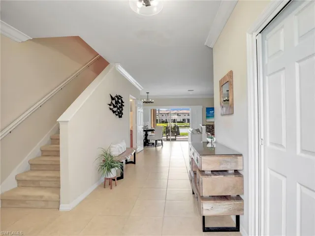Front entry, Garage door to the right and stairs lead to the upstairs bedrooms
