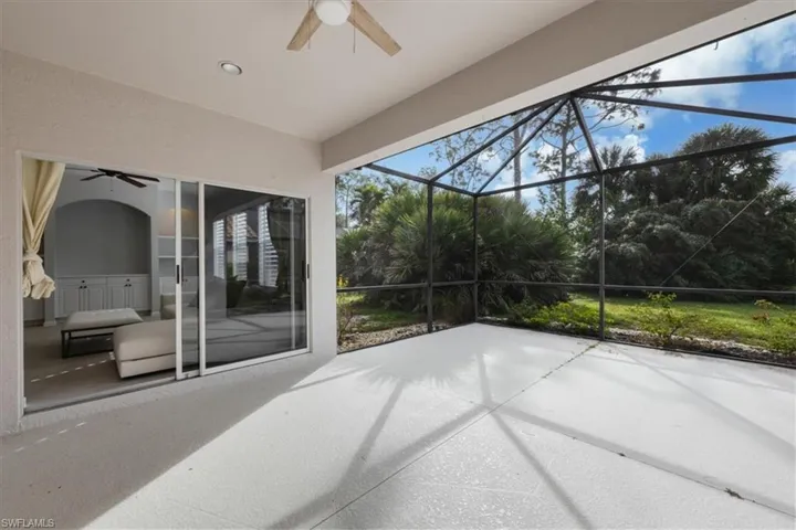 View of patio / terrace with a ceiling fan, a sunroom, and a lanai