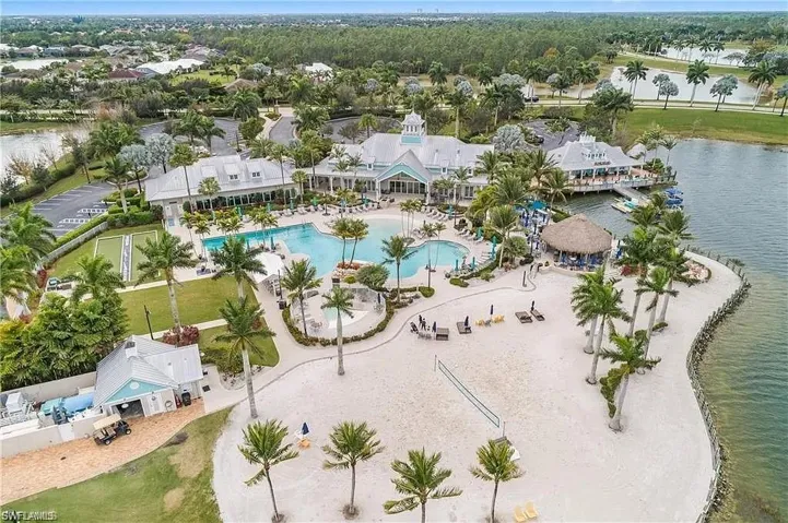Bird's eye view of a pool area and a large body of water