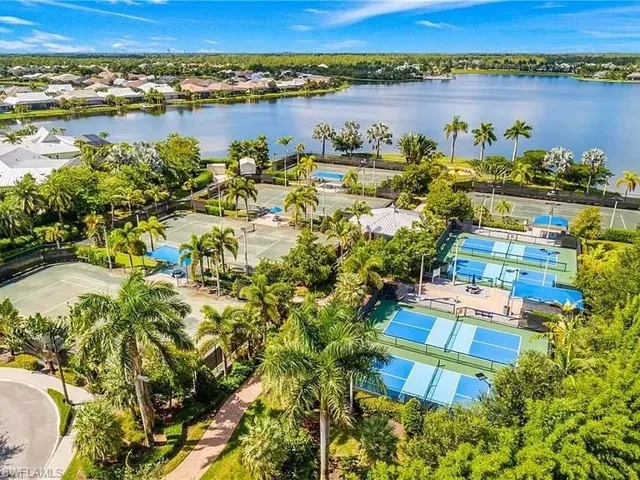 Aerial perspective of suburban area featuring a large body of water