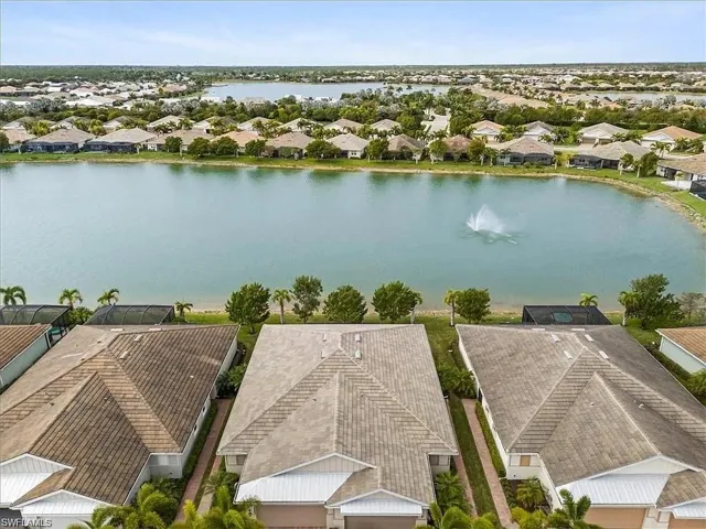 Aerial perspective of suburban area with a nearby body of water