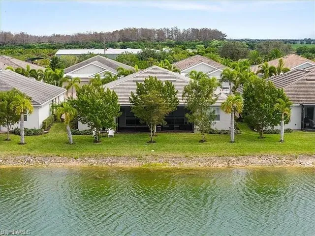 Aerial perspective of suburban area with a nearby body of water