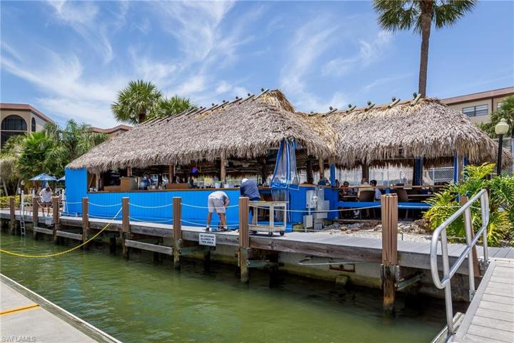 Dolphin Tiki Bar is the place to enjoy a cocktail, a meal and take in the beautiful Marco River view.