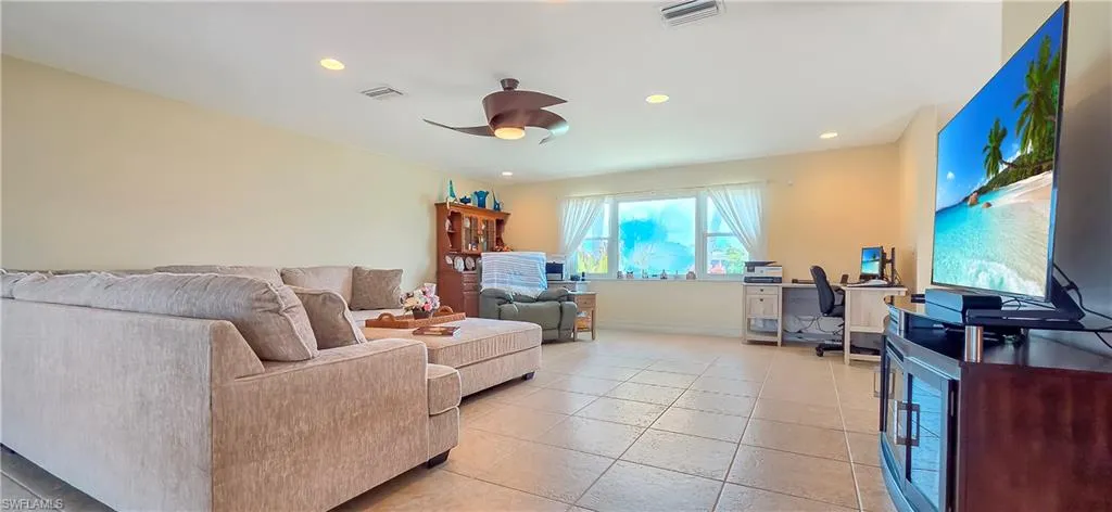 Spacious common area featuring recessed lighting, a modern ceiling fan, and tile flooring