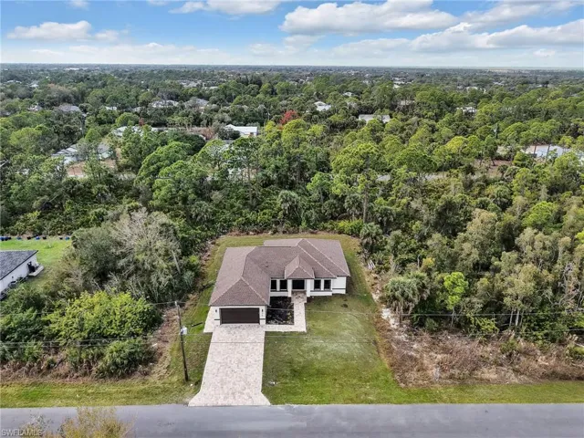 View from above of property featuring a forest