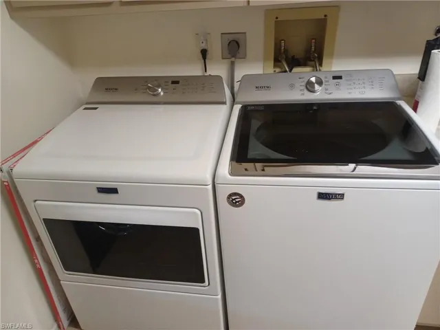 Laundry area featuring independent washer and dryer
