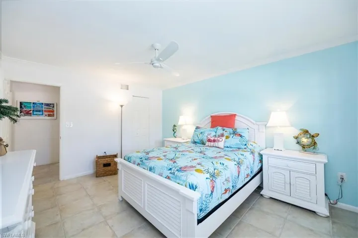 Bedroom with visible vents, baseboards, a closet, and a ceiling fan