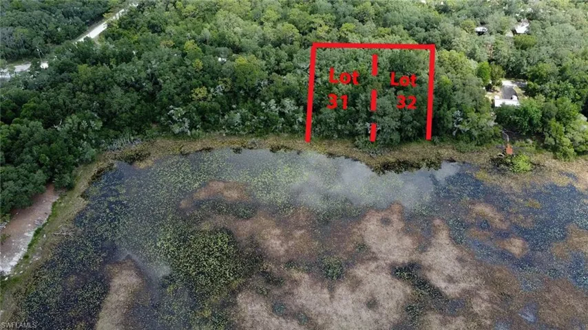 Aerial view of property's location with property boundaries highlighted and a heavily wooded area