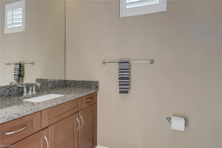 Bathroom with vanity and a skylight