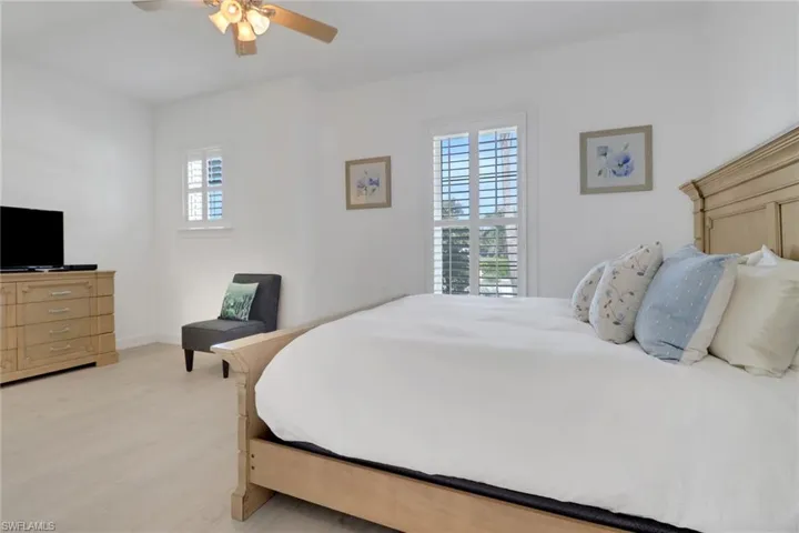 Bedroom with light wood-type flooring and ceiling fan