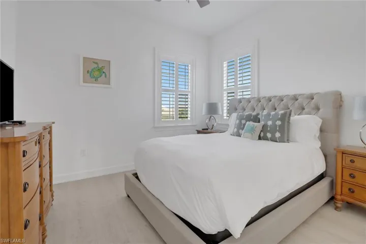 Bedroom featuring ceiling fan and light wood-type flooring