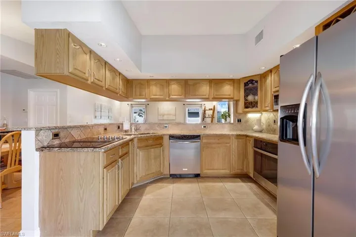 Stainless Steel appliances with oak cabinets and granite countertops