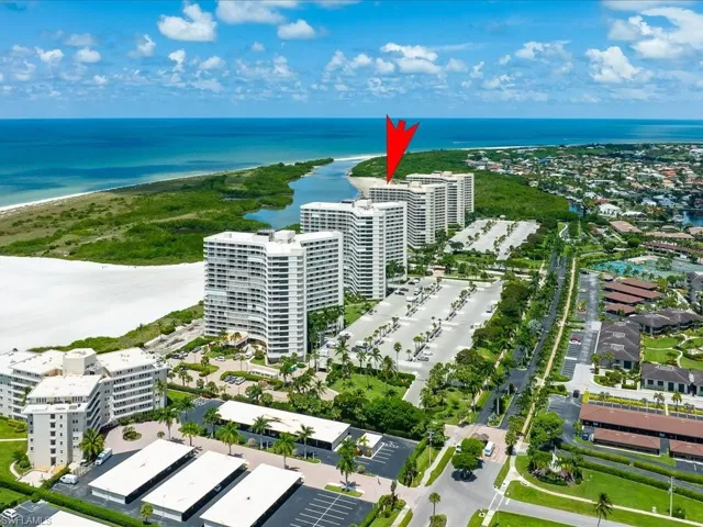 Bird's eye view of a large body of water and apartment complex / building