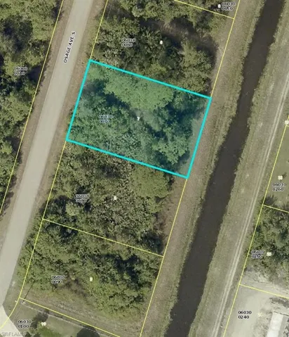 Aerial map of property and surrounding area with property parcel outlined