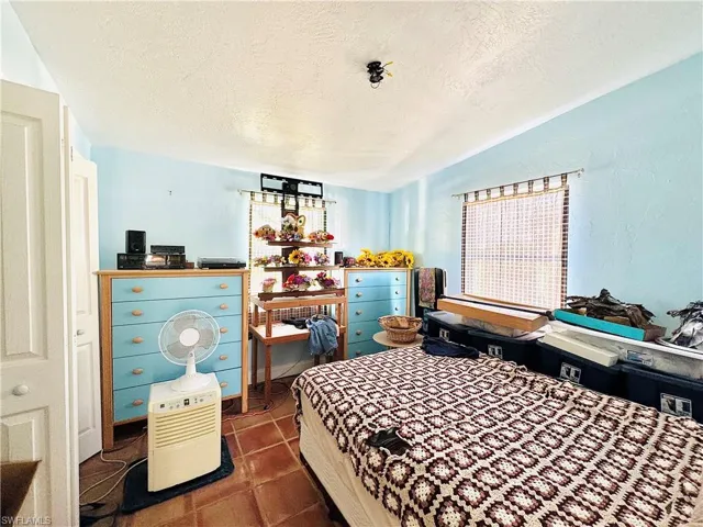 Bedroom with a textured ceiling