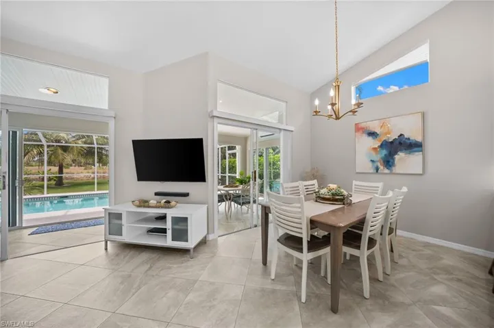 Living and dining flow together the way Florida living should- open, easy, and full of light